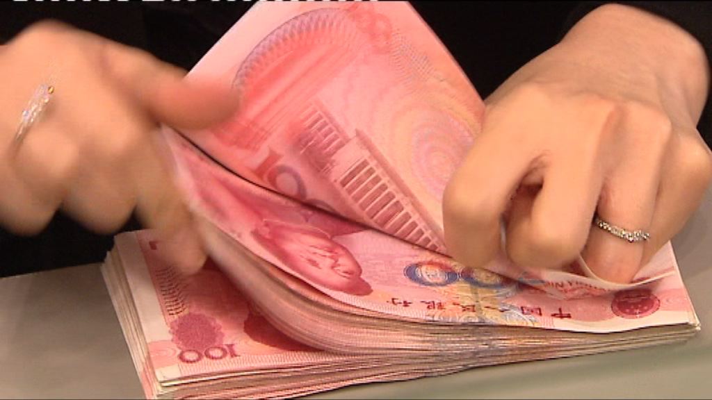 新華社：人民幣貶值　勿跟風搶外幣
